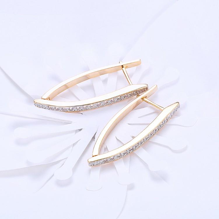 Swarovski Crystal Micro-Pav'e Curved Huggie Earrings Set in Goldtone - Riakoob Jewelry www.goldennycjewelry.com fashion jewelry for women