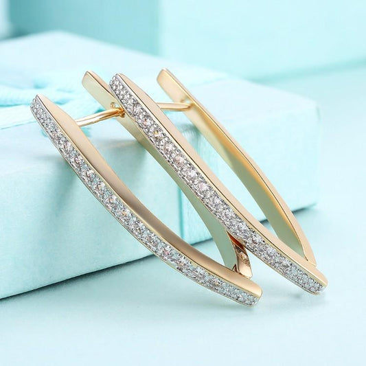 Swarovski Crystal Micro-Pav'e Curved Huggie Earrings Set in Goldtone - Riakoob Jewelry www.goldennycjewelry.com fashion jewelry for women