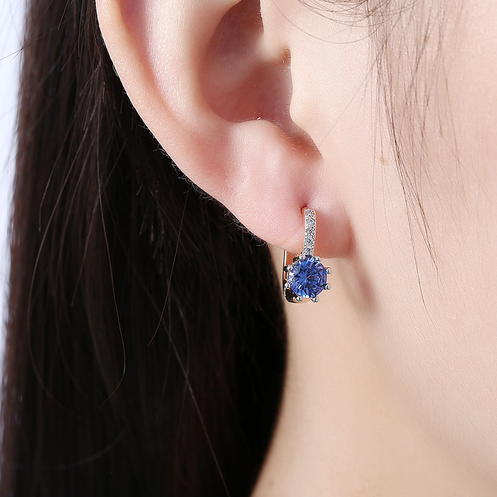 Blue Topaz 0.70 CT Round Huggie Earring in  Silvertone