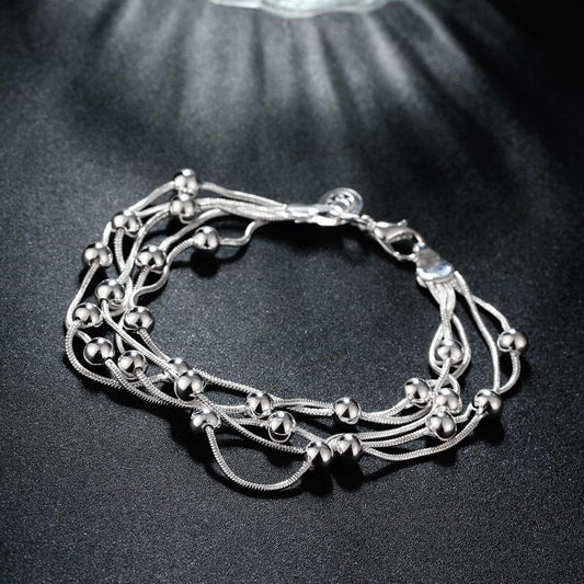 Silvertone Orchid Pearls Dangling Strands Bracelet